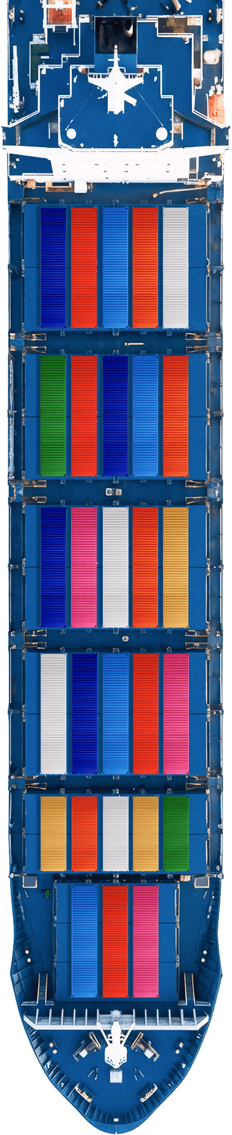 Aerial view of a cargo ship loaded with colorful shipping containers in rows on a blue deck.